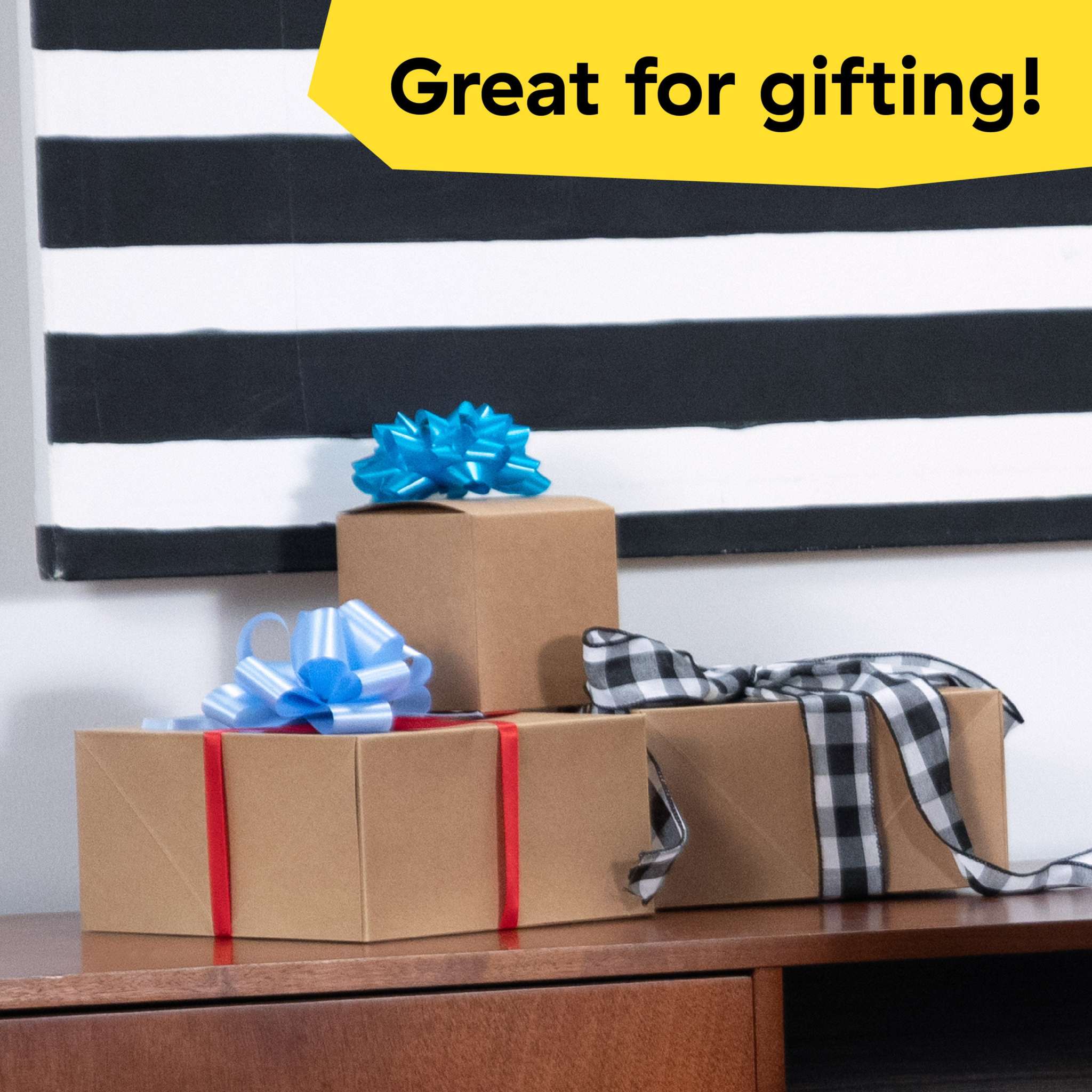 Gift wrapped boxes with colorful bows on wooden table, great for gifting Baby Einstein First Tunes musical gift set