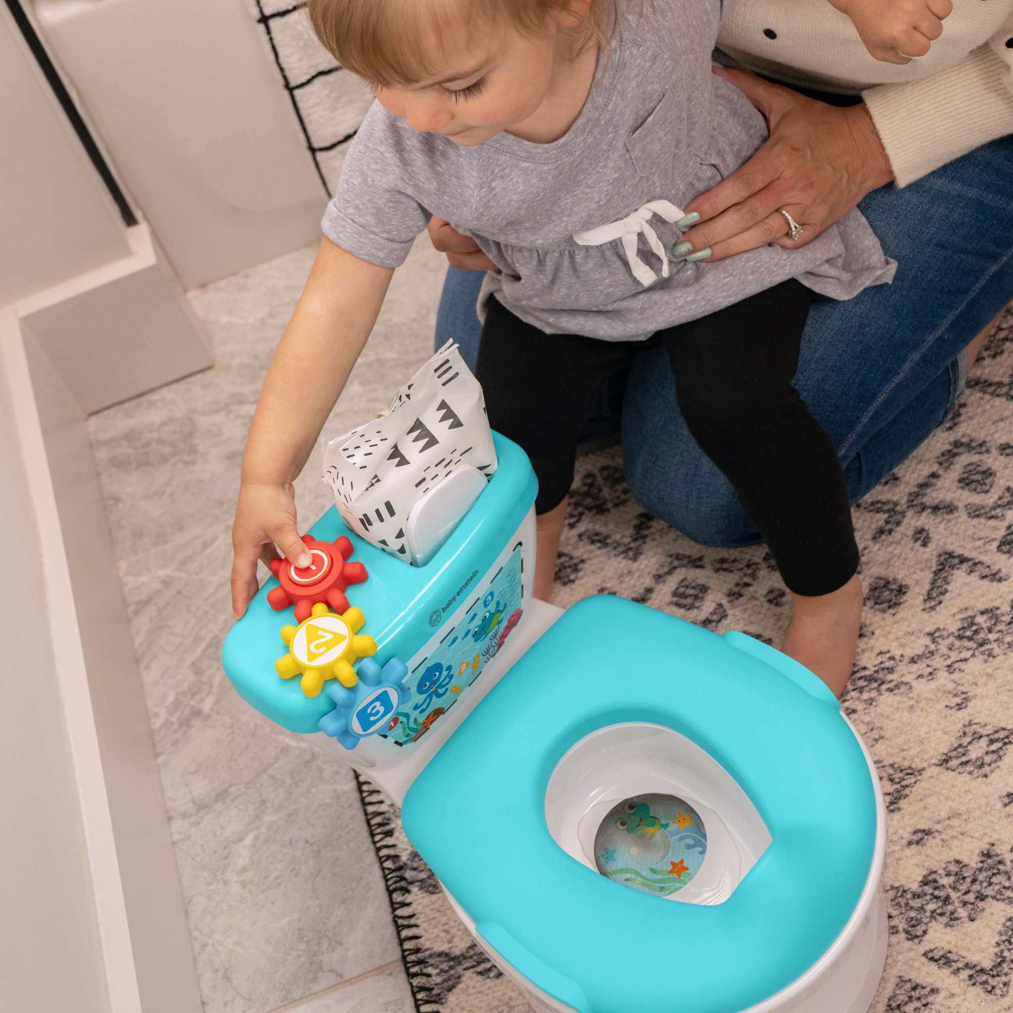 Baby Einstein 2-in-1 potty training system with spinning gears and flushing sounds
