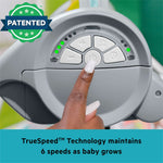 Bright Starts Playful Paradise Portable Swing with rainbow design and interactive toys for babies