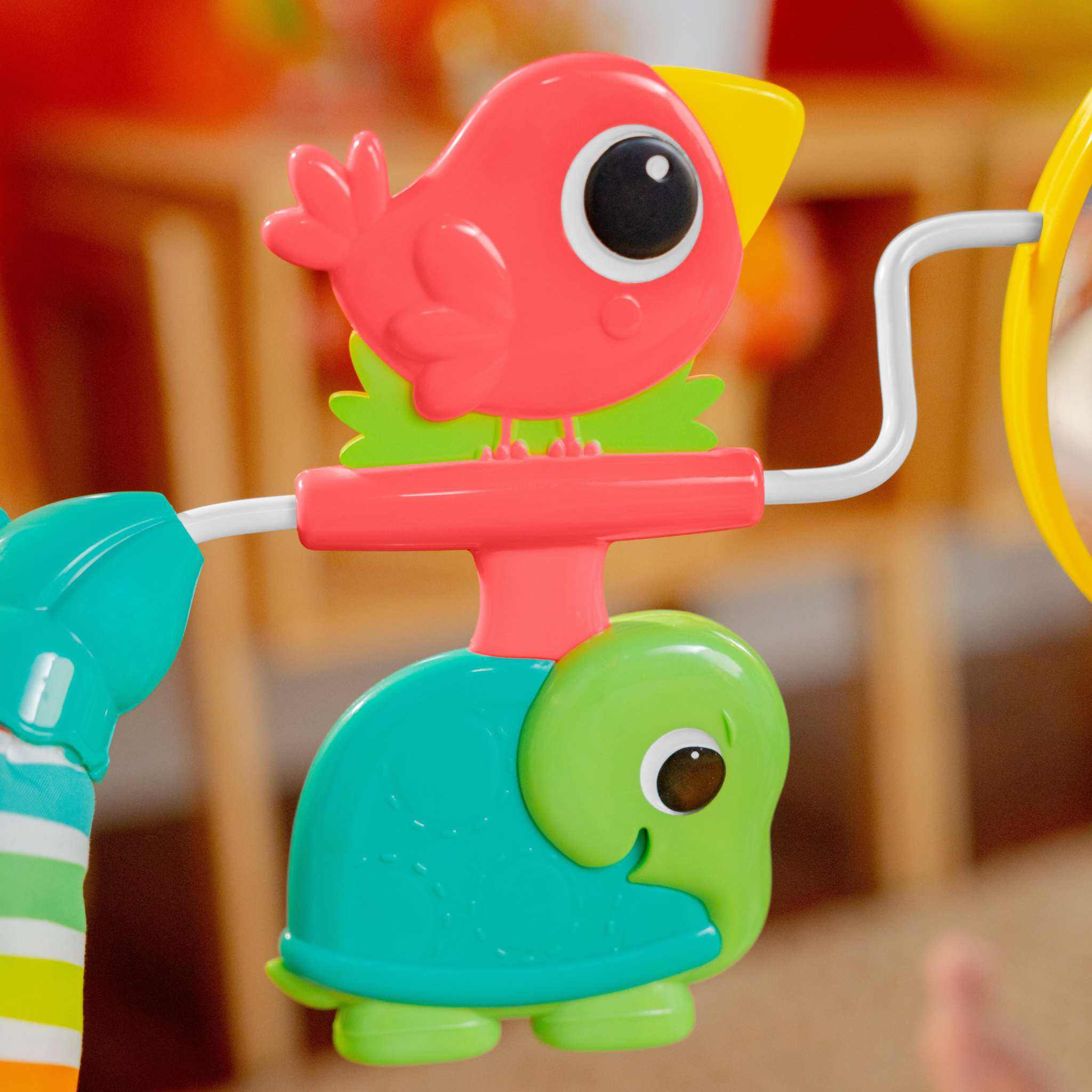 Bright Starts Playful Paradise vibrating baby bouncer with hanging toys and mirror