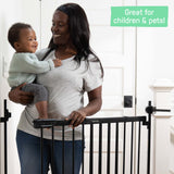 Ingenuity Stairway+ 46W Series black metal baby and dog gate installed on staircase