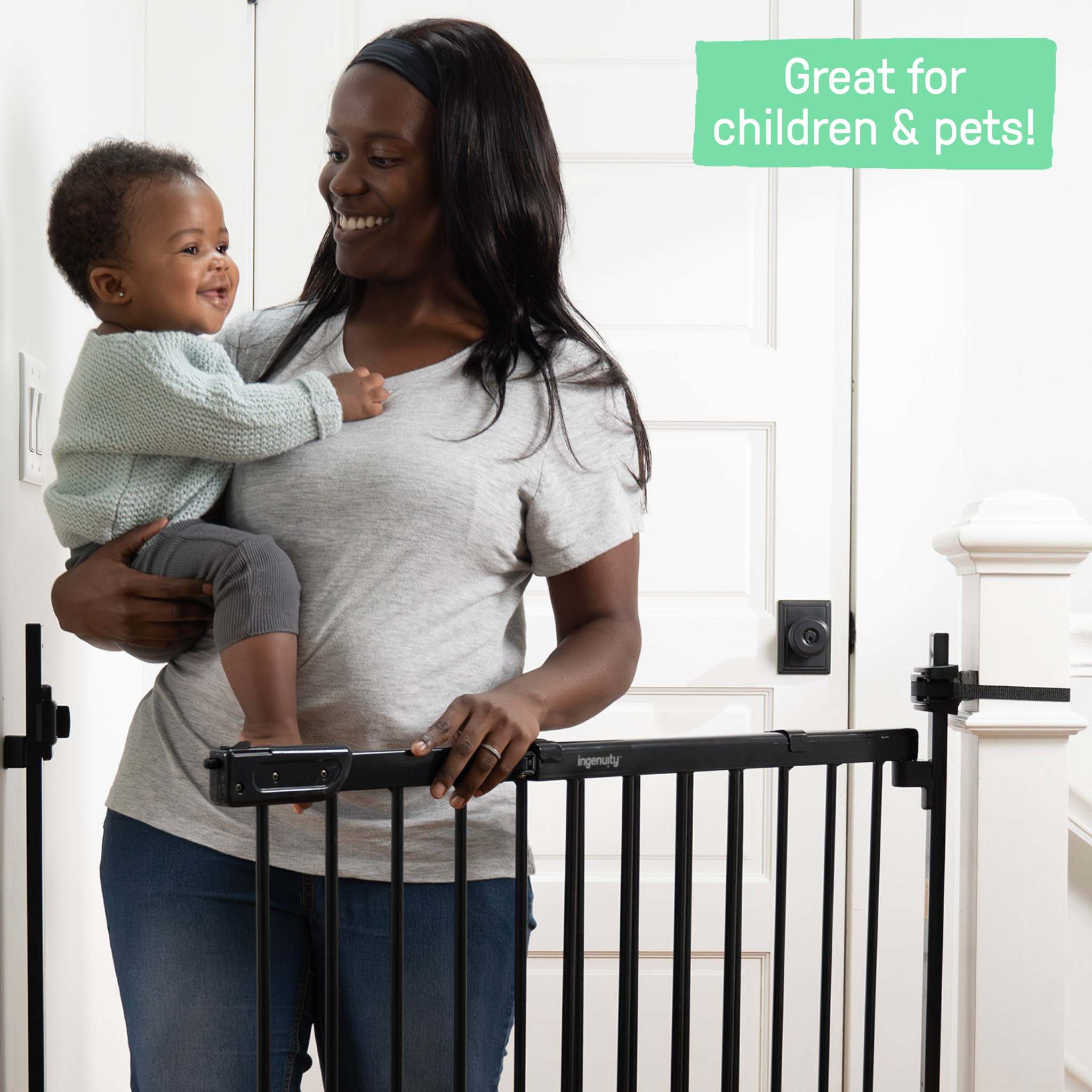 Ingenuity Stairway+ 46W Series black metal baby and dog gate installed on staircase