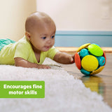 Baby playing with Bright Starts Wobble & Rattle Gift Set encouraging fine motor skills development