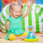 Bright Starts Press & Glow Spinner baby toy with spinning star, lights, and melodies for infants 6 months and up