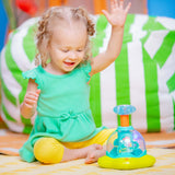 Bright Starts Press & Glow Spinner baby toy with spinning star, lights, and melodies for infants 6 months and up