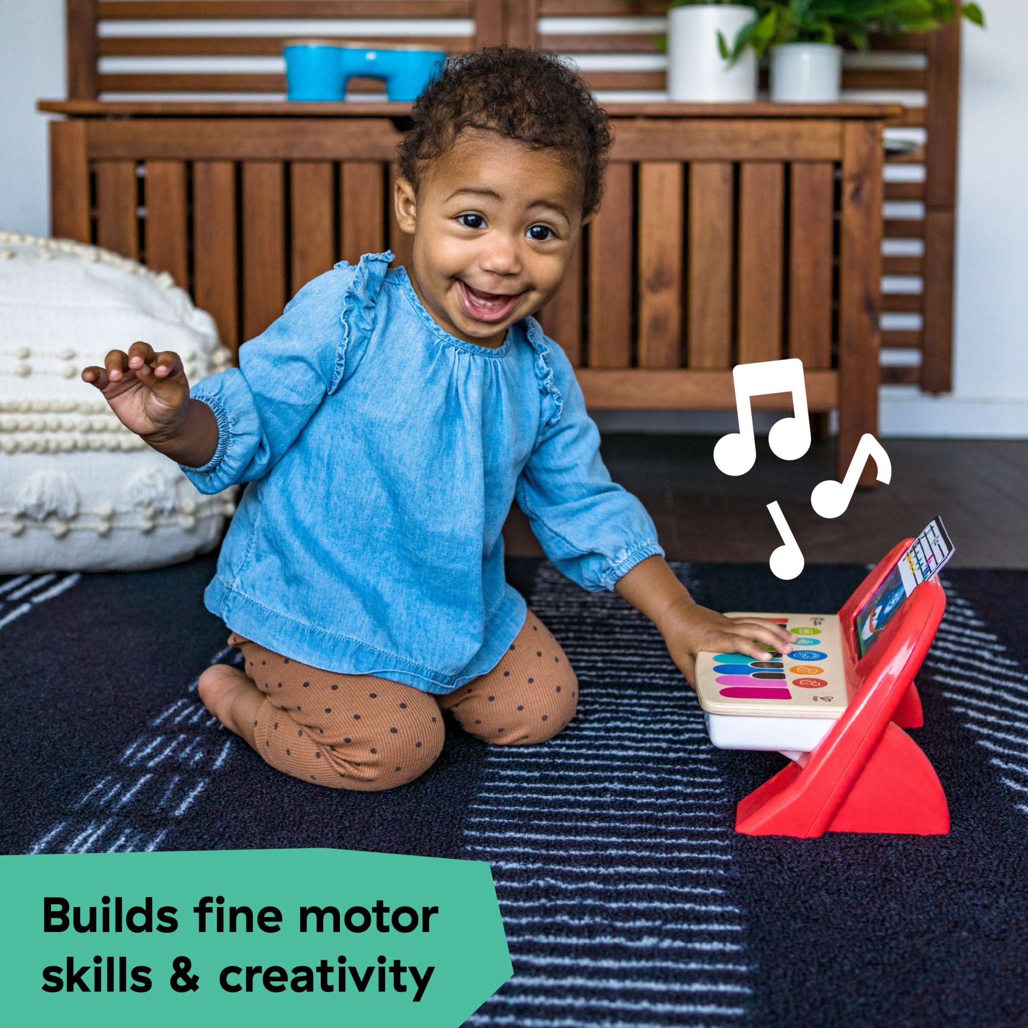 Baby playing with Baby Einstein First Tunes Magic Touch Piano and Shakers musical toy set on floor