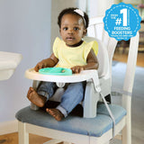 Ingenuity Deluxe Learn-to-Dine Feeding Seat with lock-in Twist & Dine plates and 3-point harness for infants and toddlers