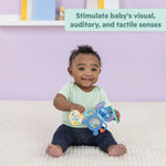 Baby playing with Disney Baby Stitch Tropical Treasures sensory toy set stimulating visual, auditory, and tactile senses