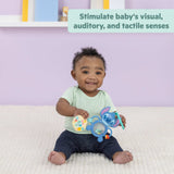 Baby playing with Disney Baby Stitch Tropical Treasures sensory toy set stimulating visual, auditory, and tactile senses