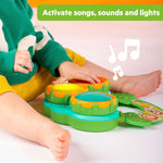 Baby playing with Bright Starts Safari Sounds Gift Set musical drum toy with lights and sounds