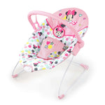 baby in a minnie mouse spotty dotty vibrating bouncer for babies