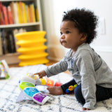 baby playing with a glow & discover light bar activity station