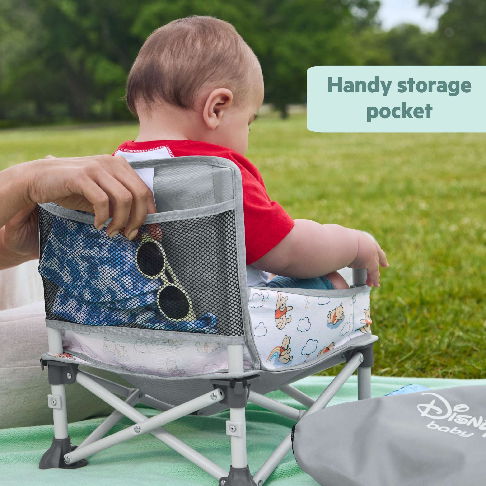 Bright Starts Disney Baby Pop 'N Sit portable booster seat with Winnie the Pooh design for infants and toddlers