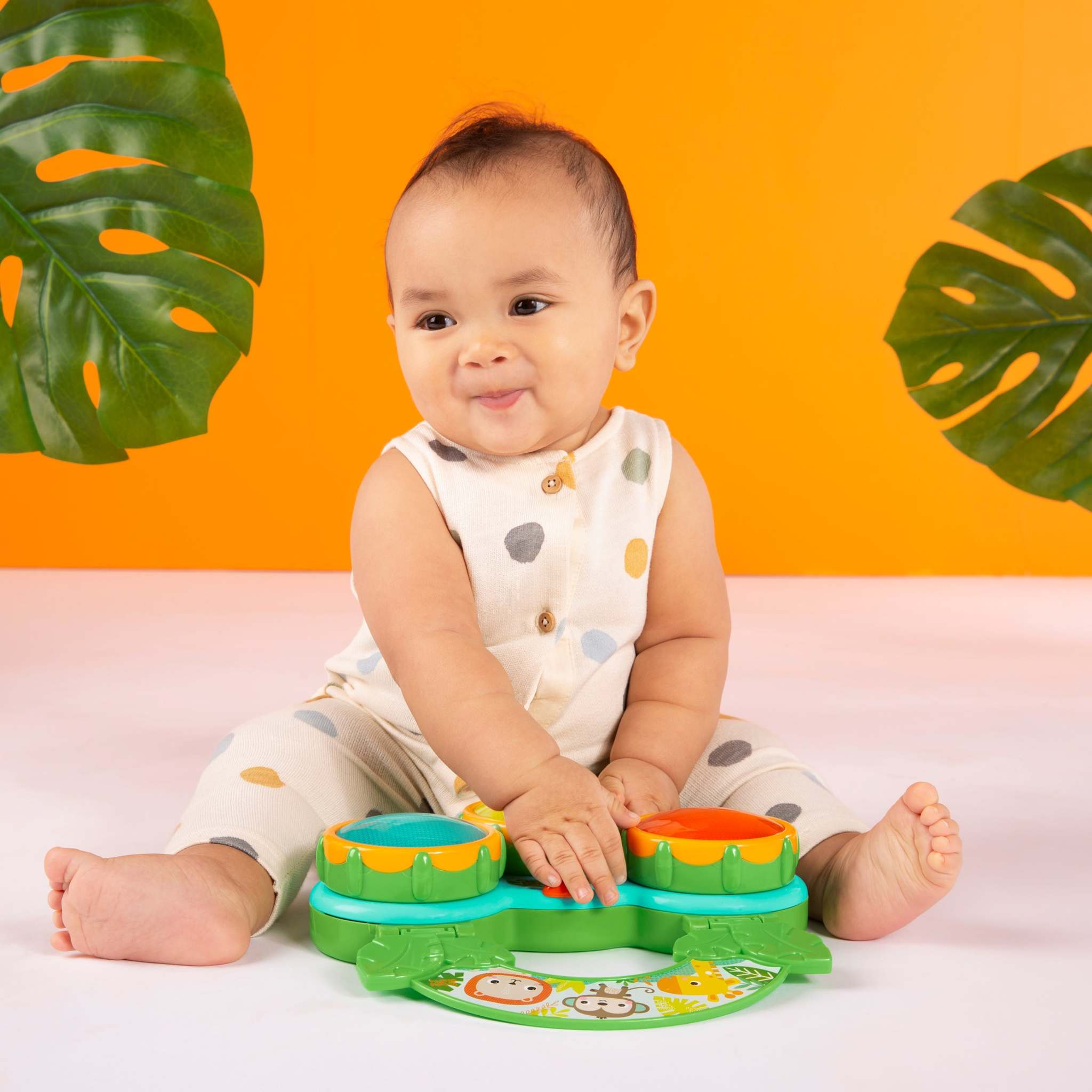 child playing with a safari beats musical toy