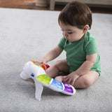 baby playing with a glow & discover light bar activity station