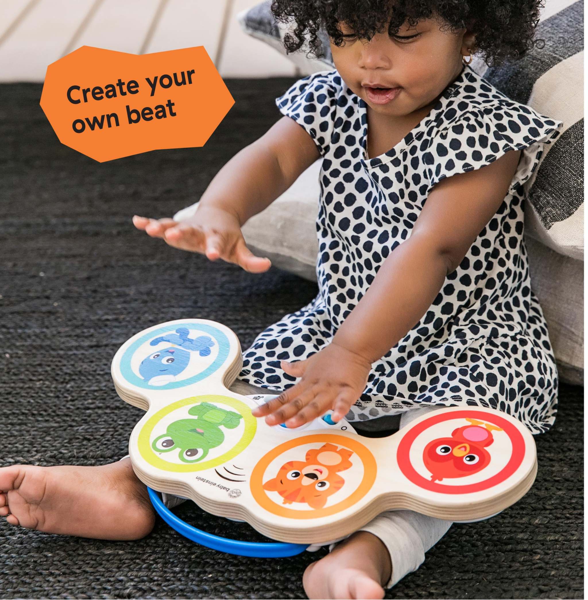 Baby Einstein Magic Touch Drums wooden musical toy with Montessori-inspired design and volume control buttons