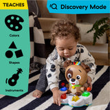 baby playing with a drum & learn dean musical learning toy