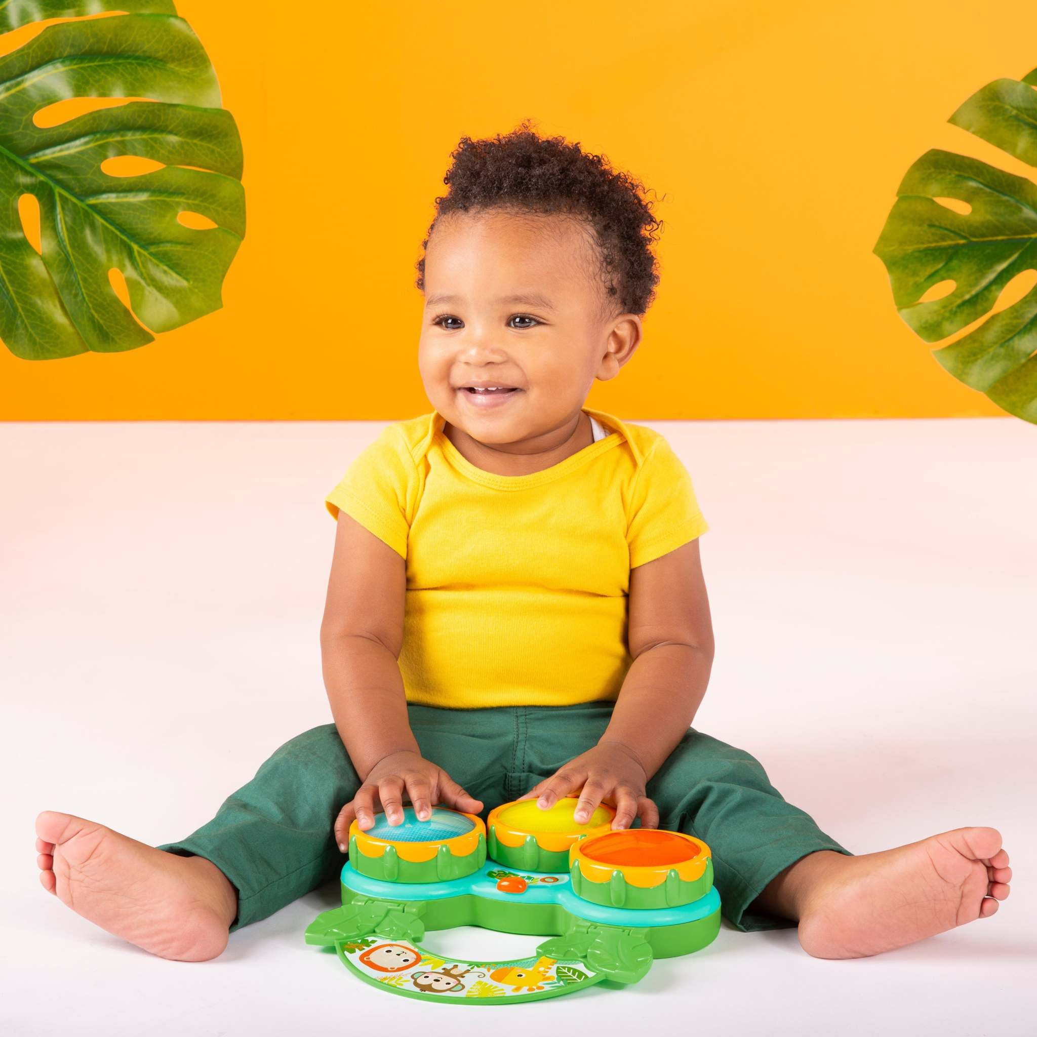 child playing with a safari beats musical toy