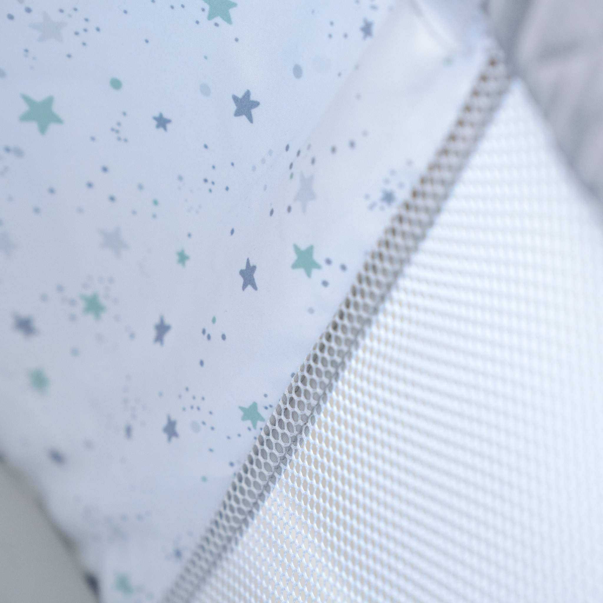 Ingenuity Dream Hero 3-in-1 co-sleeping bassinet in grey with breathable mesh sides and adjustable heights