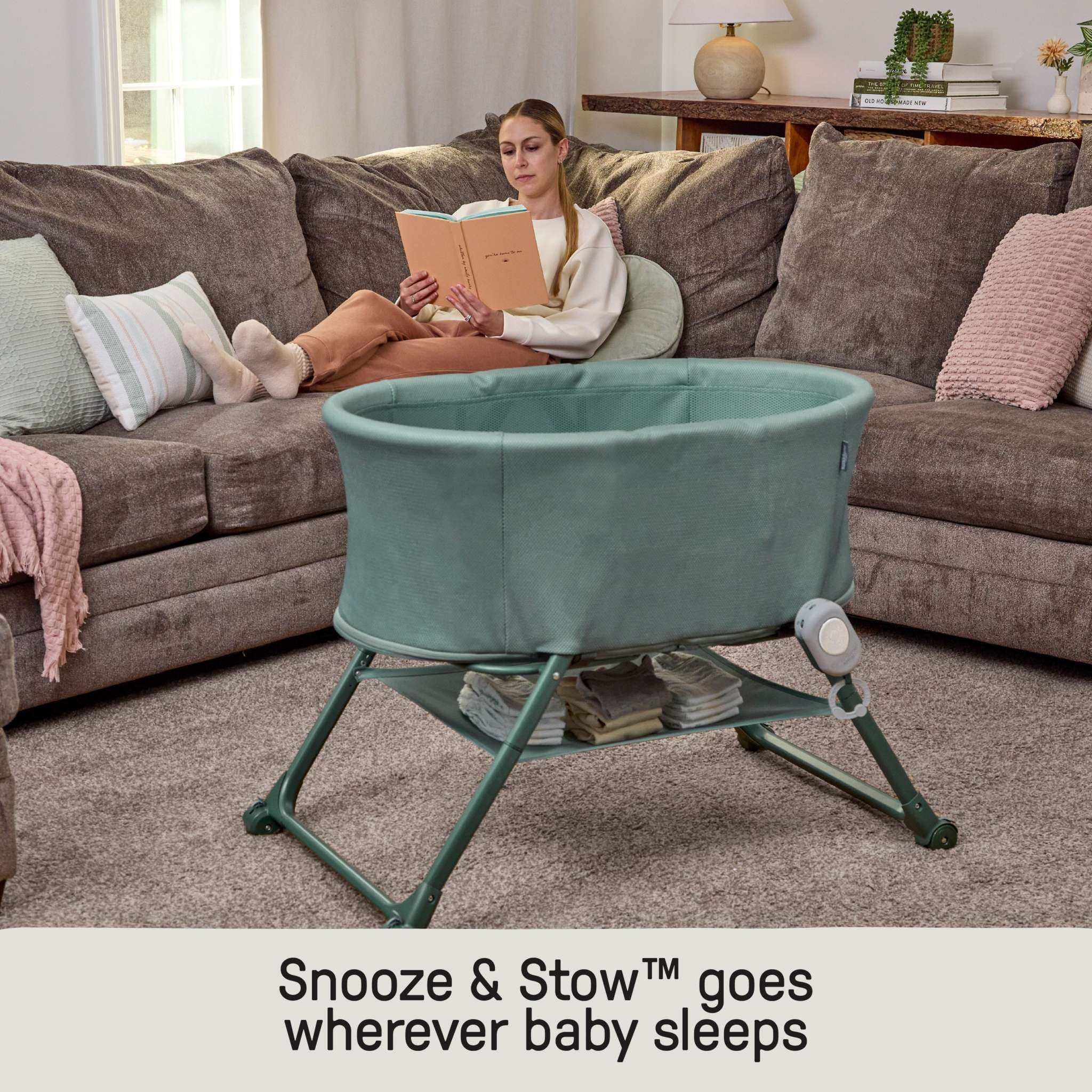 Ingenuity Snooze & Stow easy-folding baby bassinet with sound and light in luxe evergreen