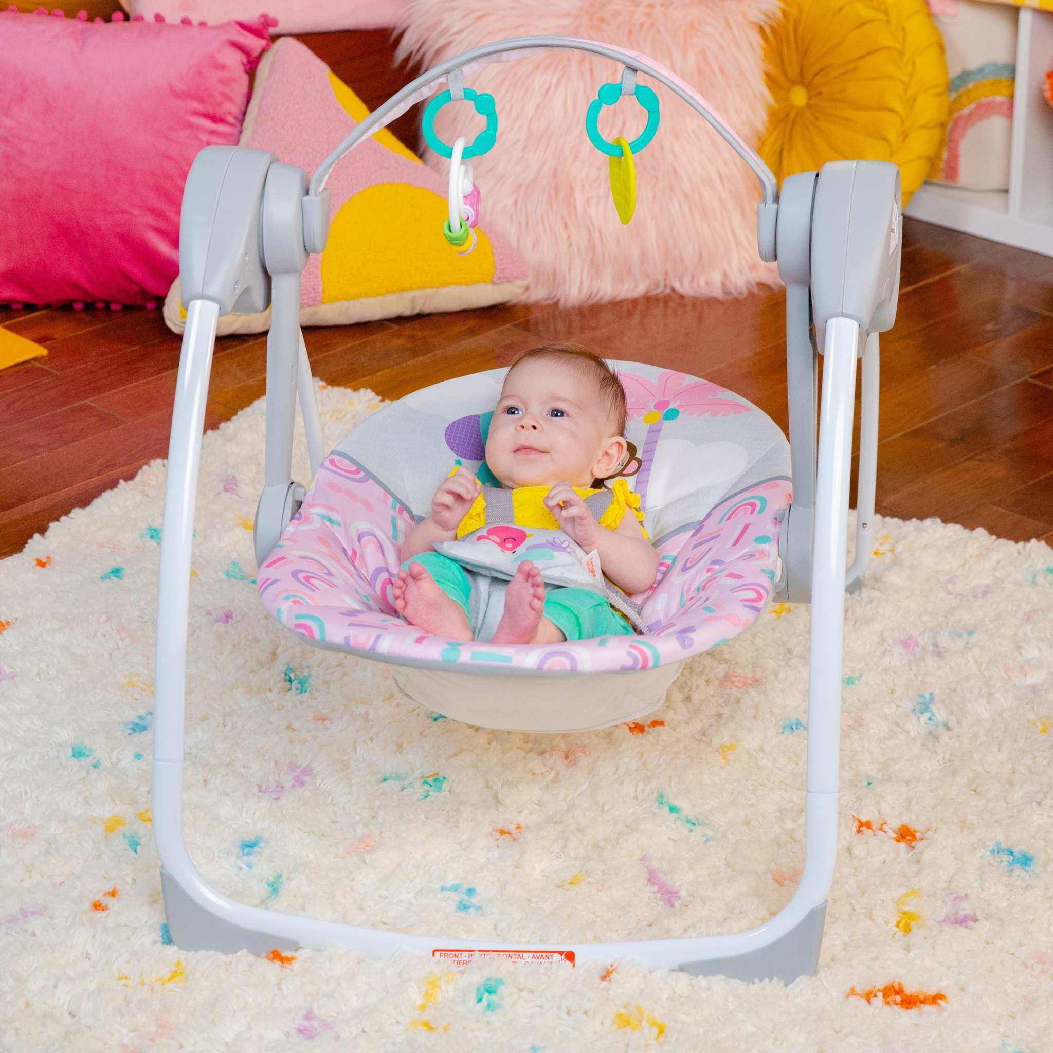 baby in a pink paradise portable swing