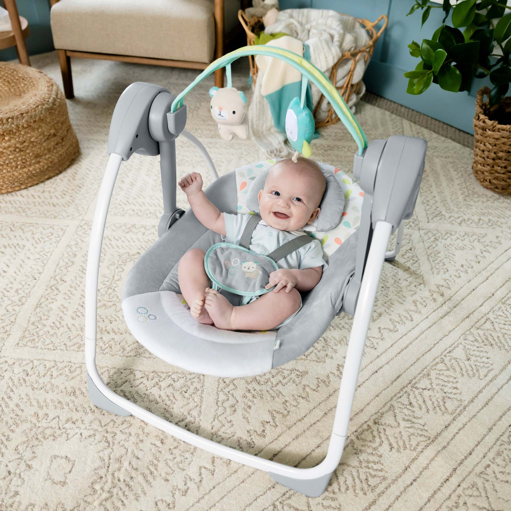 Comfort 2 Go Portable Swing with plush forest toys and soothing music for babies