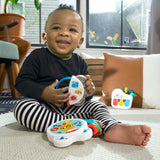 baby playing with a small symphony 3-piece musical toy set