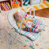 baby in rosy rainbow infant to toddler rocker