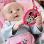 baby in a minnie mouse spotty dotty vibrating bouncer for babies