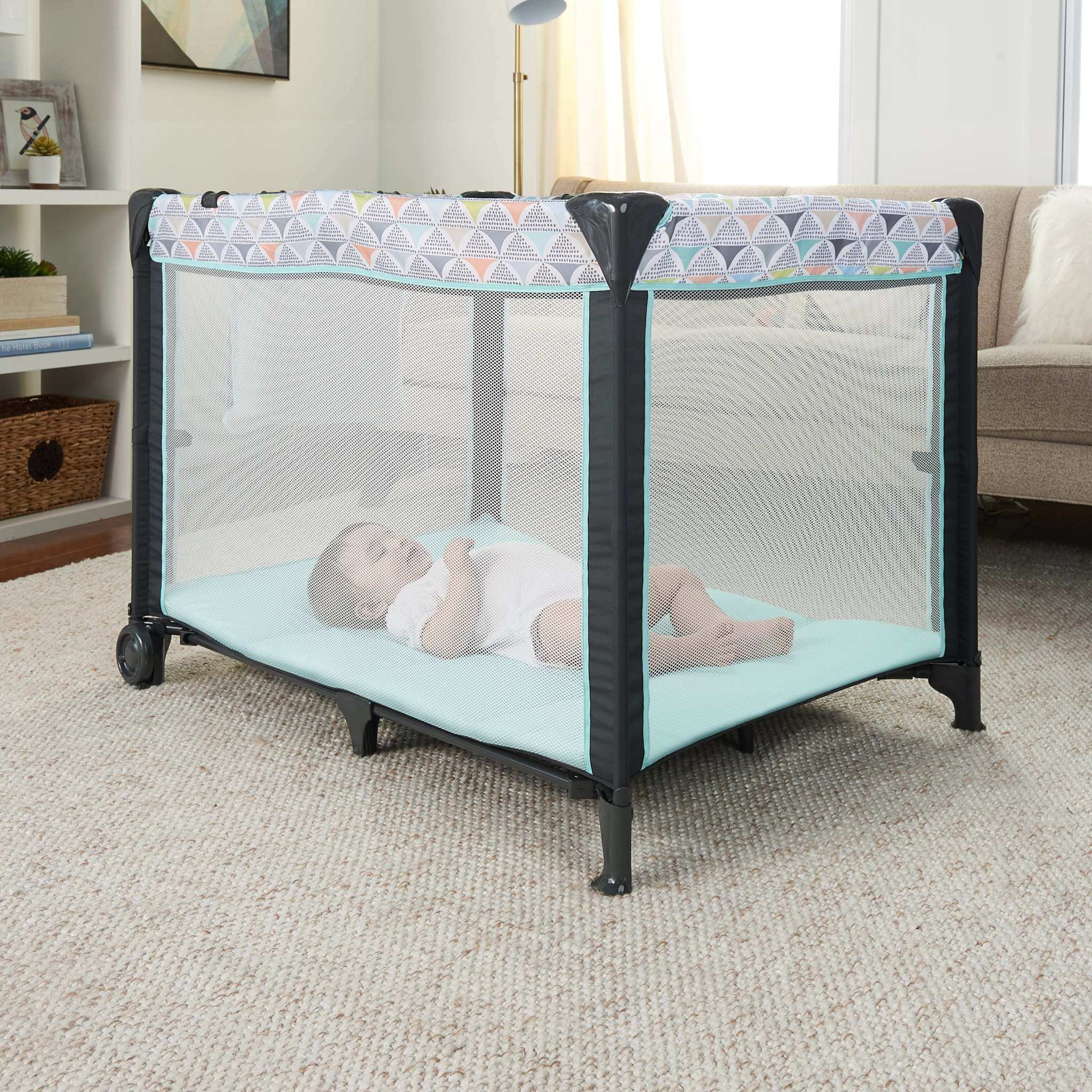Ingenuity smart and simple travel cot with bassinet and changing table