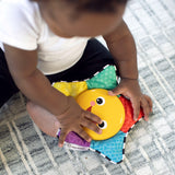 baby playing with a star bright symphony take-along toy