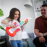 young girl playing with together in tune guitar connected magic touch guitar