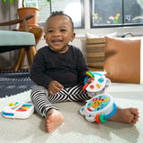 baby playing with a small symphony 3-piece musical toy set