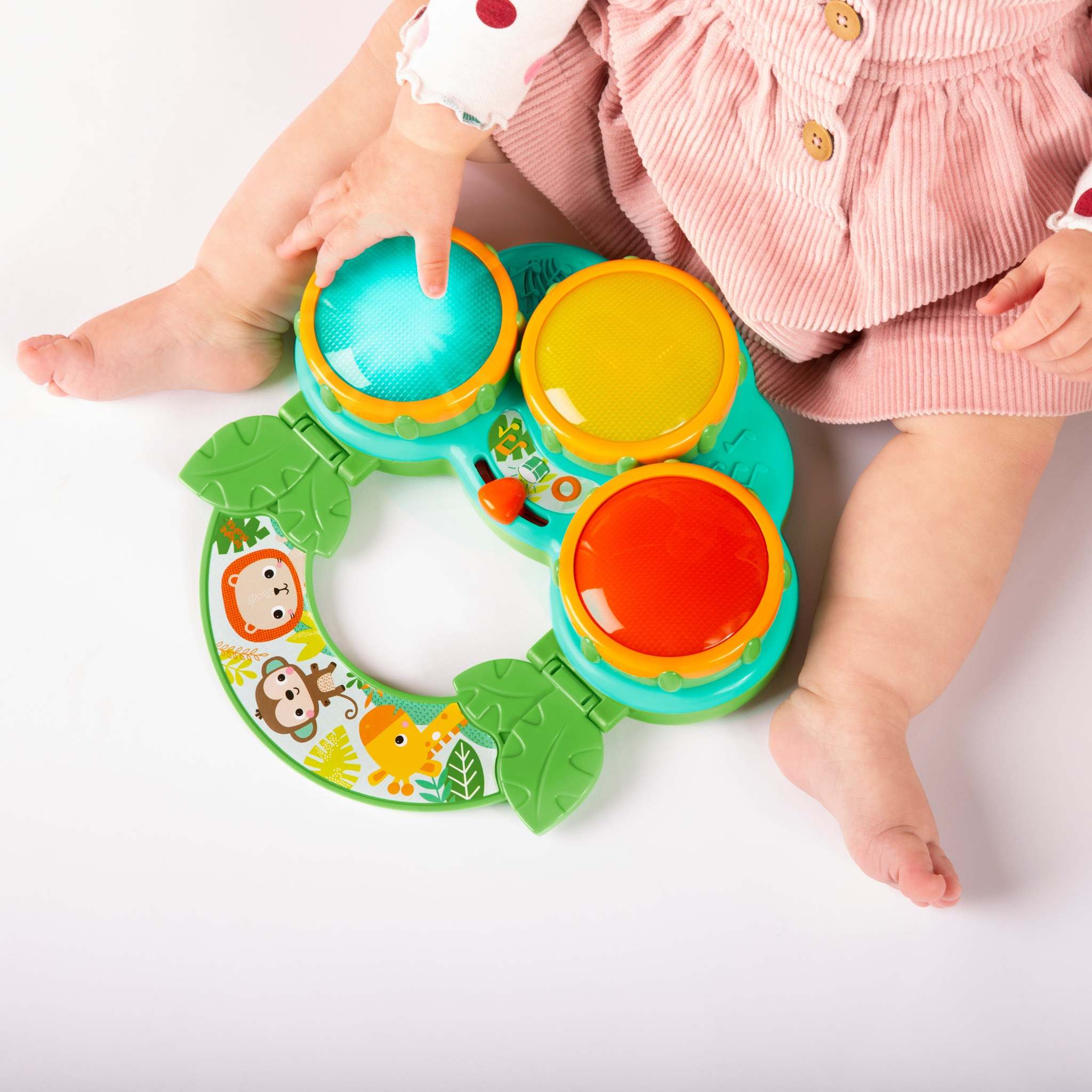 child playing with a safari beats musical toy