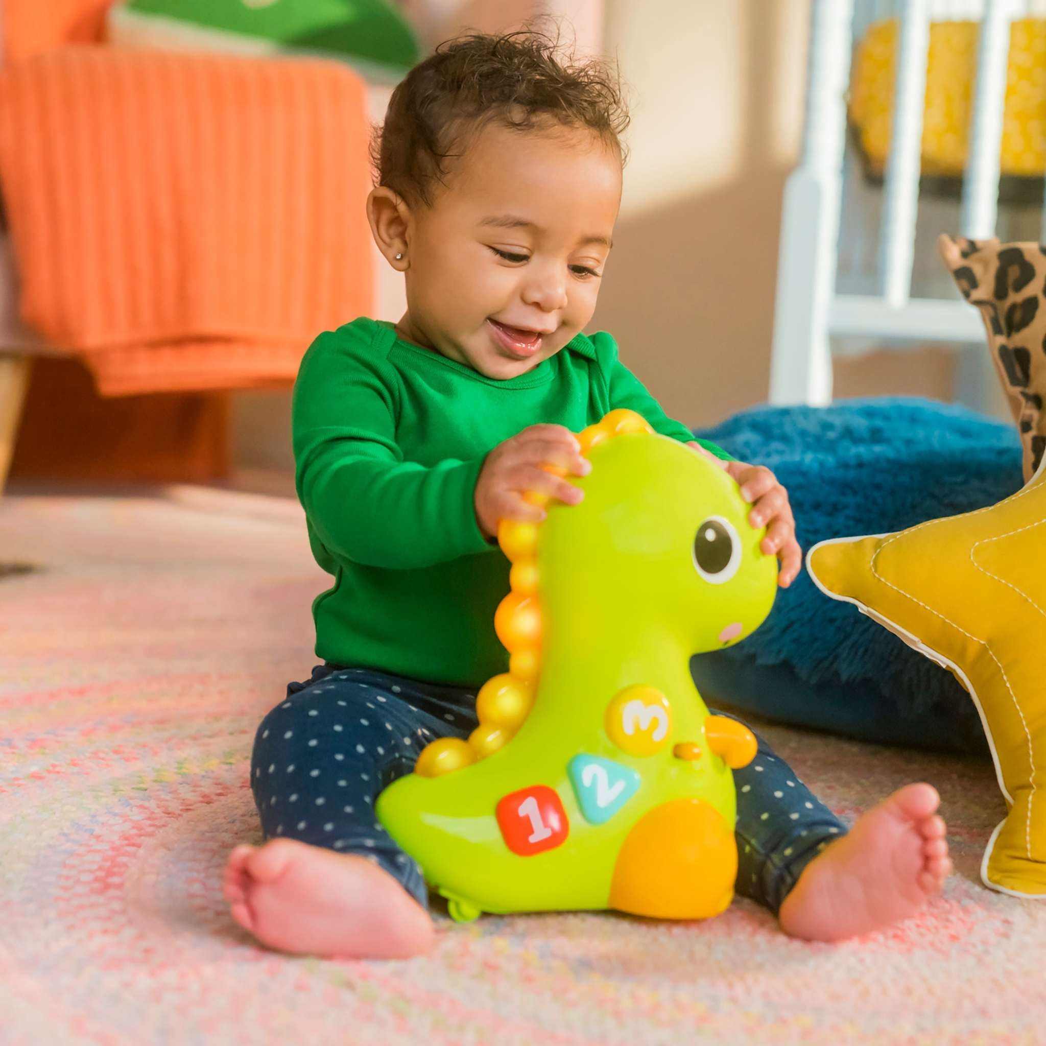 baby playing with go go dino crawl & count toy